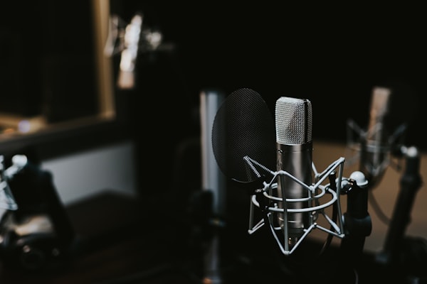 Podcaster recording with a microphone