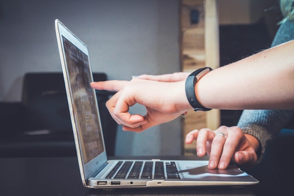 Social media creator using a laptop